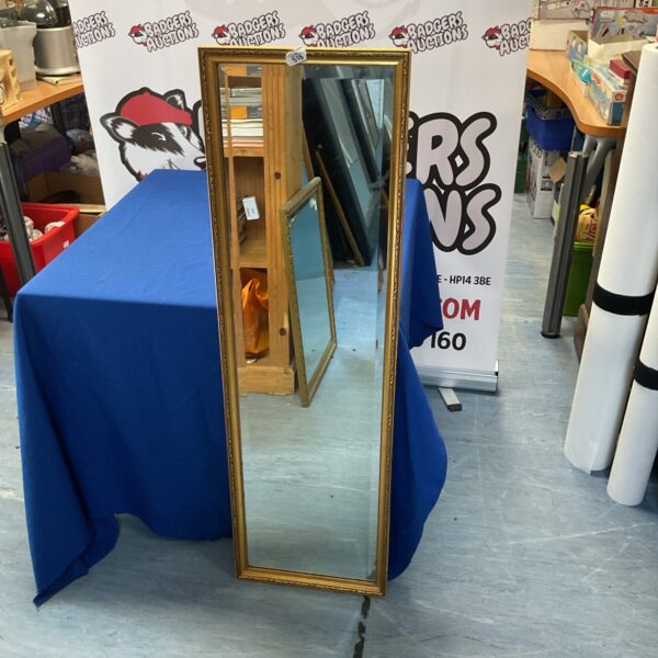 Vintage bevel edged mirror with decorative frame, 45”x13”.