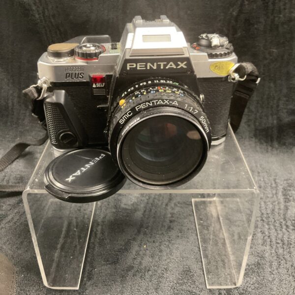 Vintage Pentax Program Plus 35mm SLR camera in silver tone.