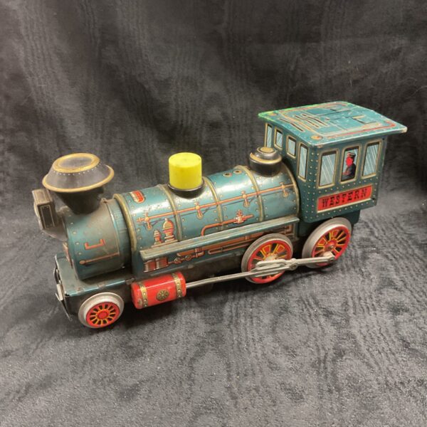 Vintage Japanese tinplate Western train, side view.