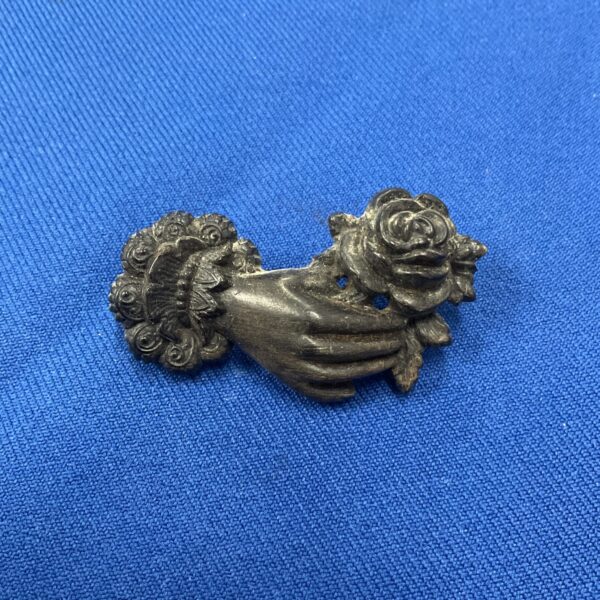 Delicate Victorian rose brooch with repousse detailing.