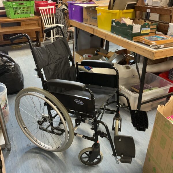 Side view of an Invacare wheelchair with footrests.