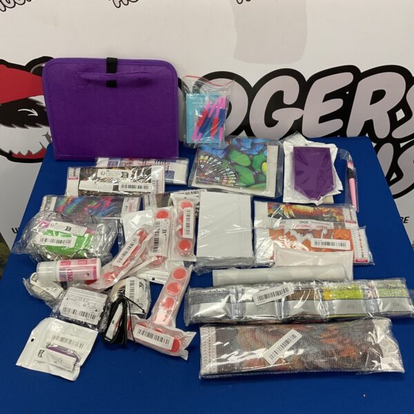 Assorted diamond art kits and accessories for crafting projects.