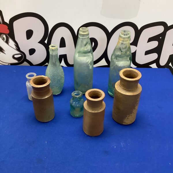 Selection of vintage glass bottles including a Clegg of Wantage bottle.