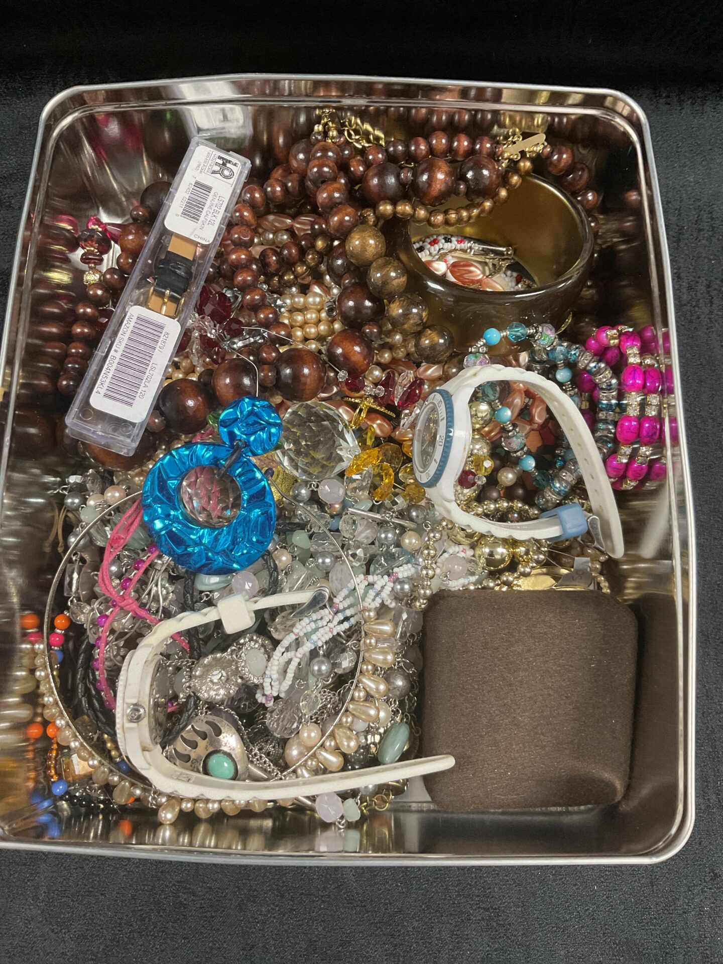 304 Tin of assorted costume Jewellery