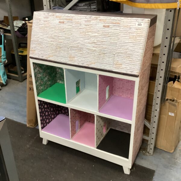 Front view of a colourful repurposed dolls house.