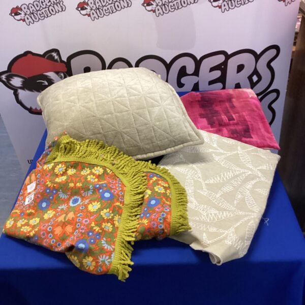 Vibrant floral retro cushion with textured edge.