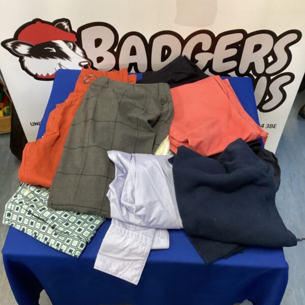 Mixed lot of second hand clothes, including shirts and trousers.