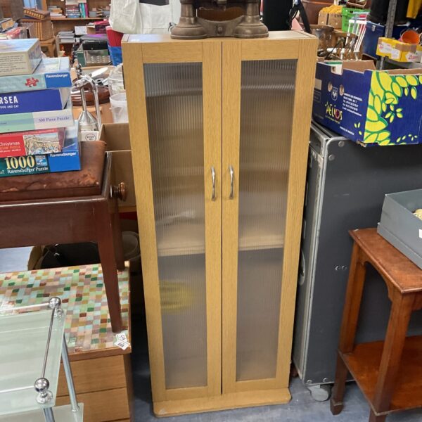 Vintage beech storage cabinet with a single door and shelving.