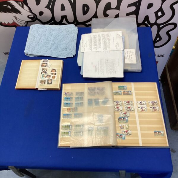 Vintage stamp albums and folder of old letters for collectors.