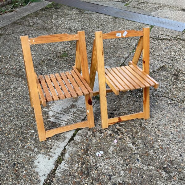 Two vintage wooden folding chairs for children or small adults.