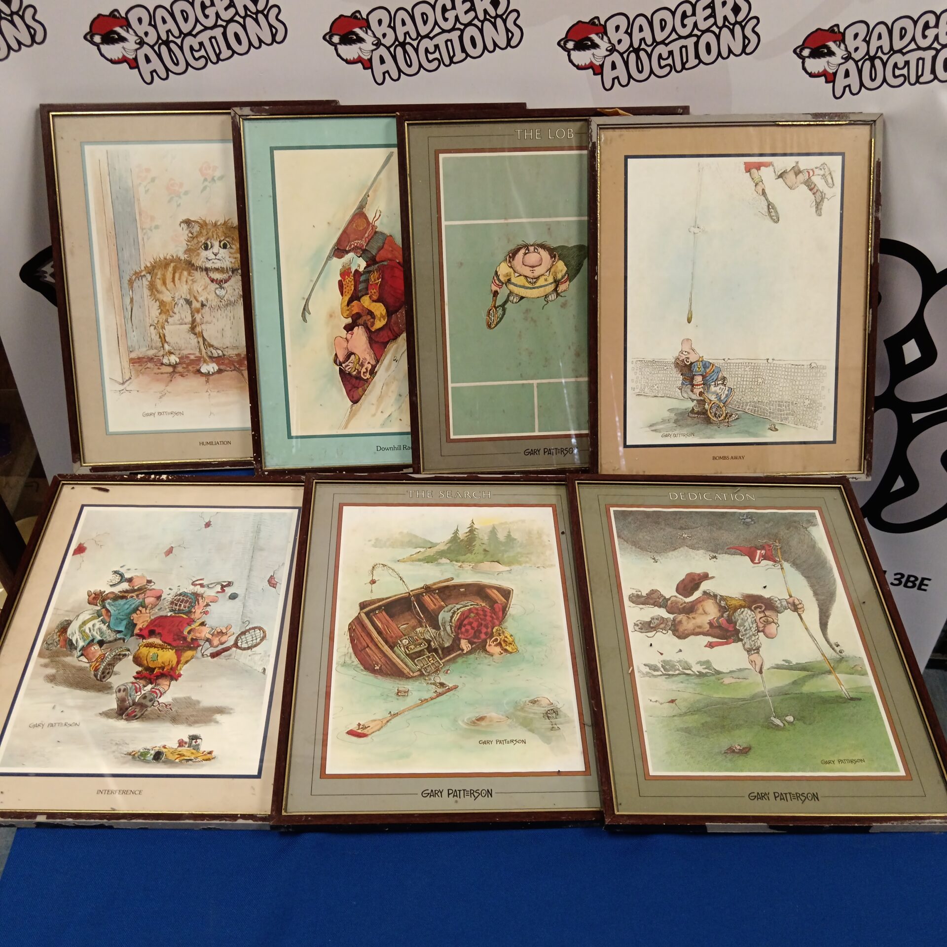 738 Set of 7 Gary Paterson comical sporting prints & a cat