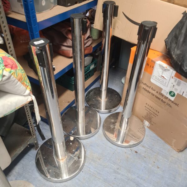 Set of four chrome cue managers for billiards cues.