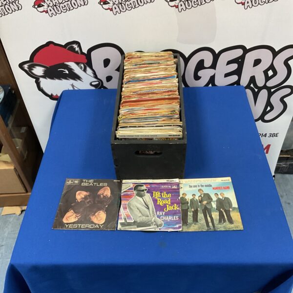 Collection of vintage 1960s vinyl singles by The Beatles, Rolling Stones, and The Who.
