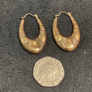 Classic 9ct gold hoop earrings with textured detail.