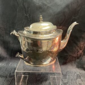 Antique silver teapot with hallmarked silver and elegant curves.