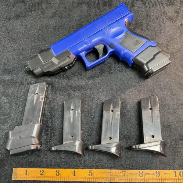 BB gun pistol set with four spare magazines for target practice.