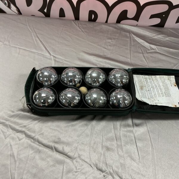 Metal boules set neatly stored in a black carrying case.
