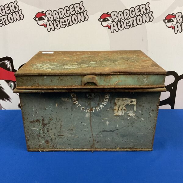 Vintage military tin trunk with "Captain C R Fraser" embossed on the side.