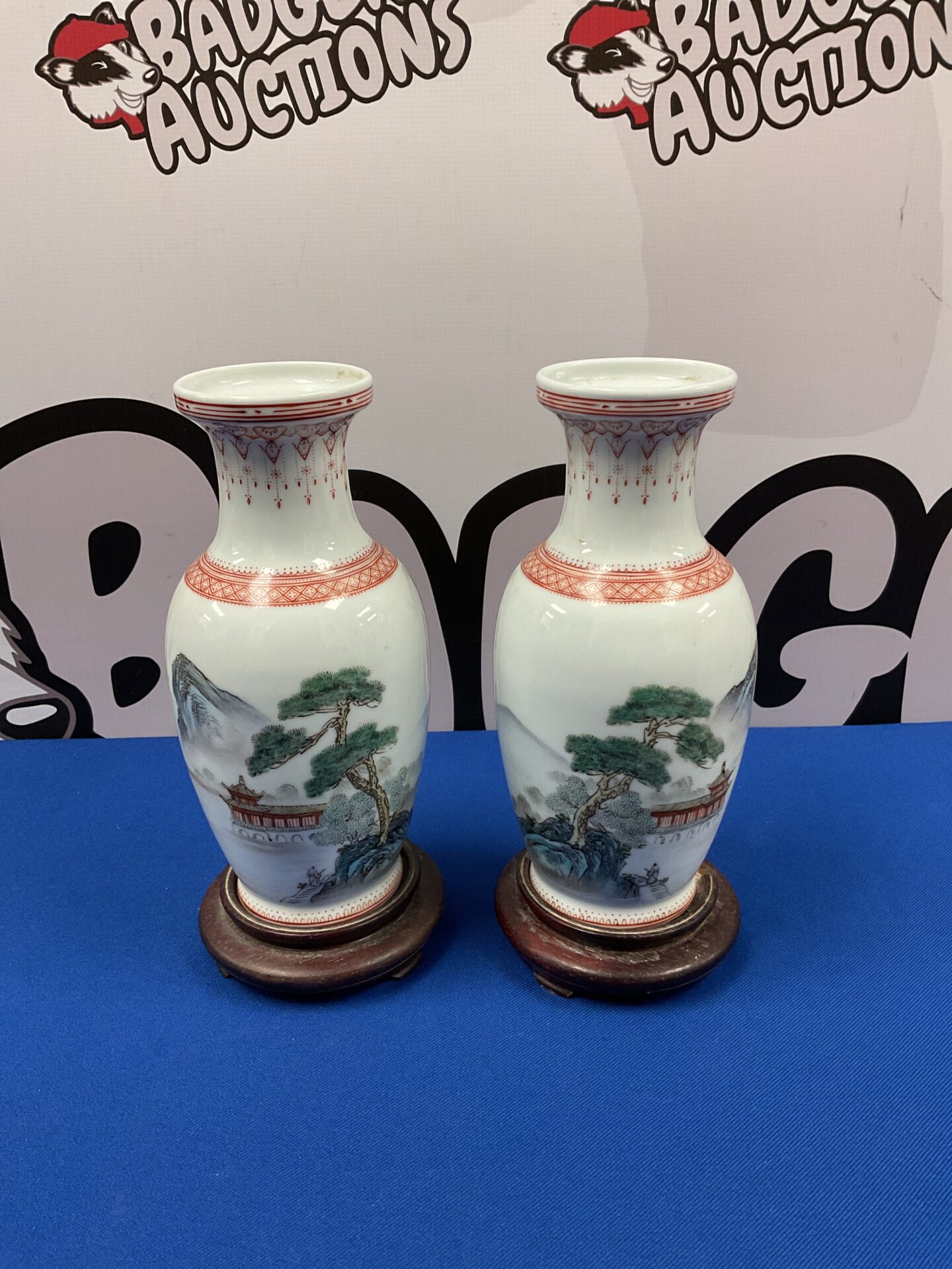 039 Pair of chinese vases on wooden bases 8.5” tall