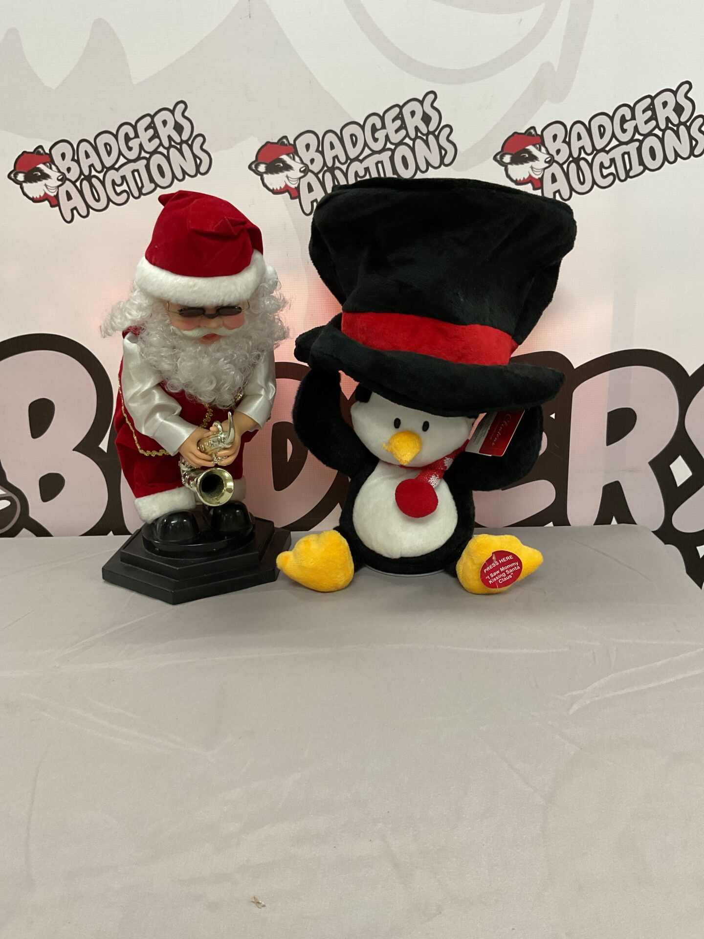 386 Two singing Christmas decorations inc santa and clintons penguin. Both working