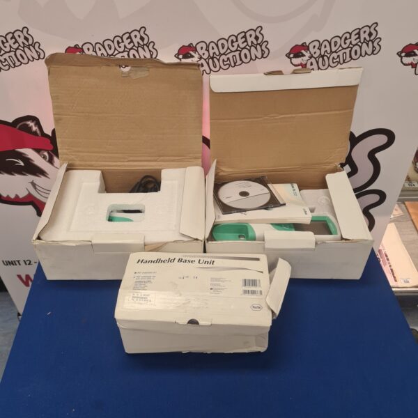 Roche Cobas handheld power supply and base unit for diagnostic testing.