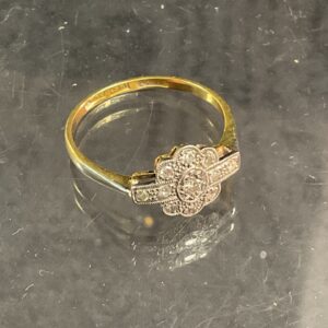 Elegant diamond cluster ring in 18ct gold and platinum setting.
