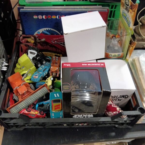 Disney Pixar diecast cars and Star Wars mug in a collectible lot.
