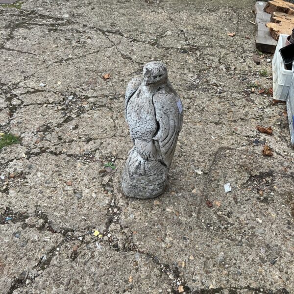 Detailed concrete falcon garden ornament for outdoor display.