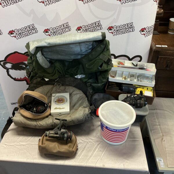 Fishing tackle lot featuring a Daiwa reel and bait boxes.