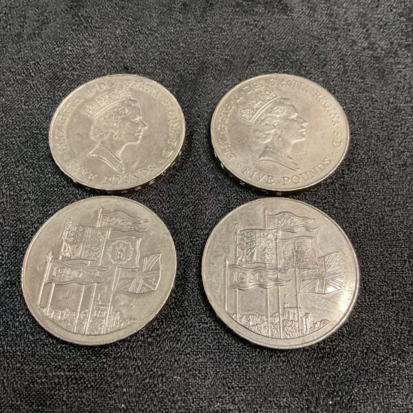 Four Five Pound coins from the UK, a collectible currency lot.