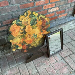 Antique floral fire guard with vibrant decoupage design.