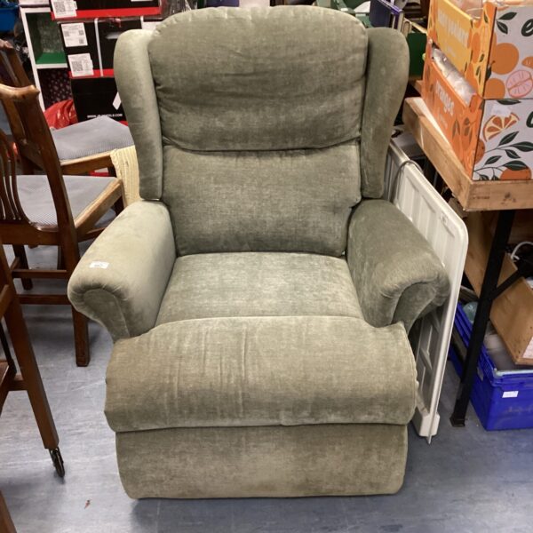 Comfortable green recliner armchair in a living room setting.