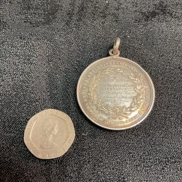 Antique silver Highland and Agricultural Society medal, detailed front view.