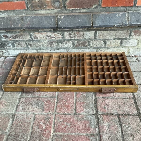 Antique Oaslon printers block tray with compartments for letterpress printing.