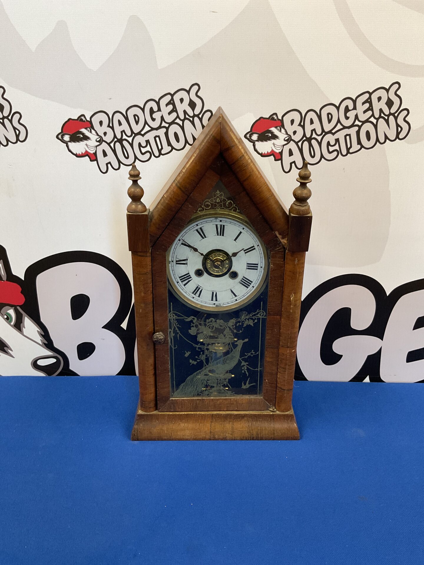 013 Antique American spire clock with peacock design on glass with pendulum & key