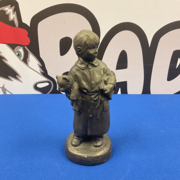 Bronze resin Christopher Robin and Winnie the Pooh figurine.