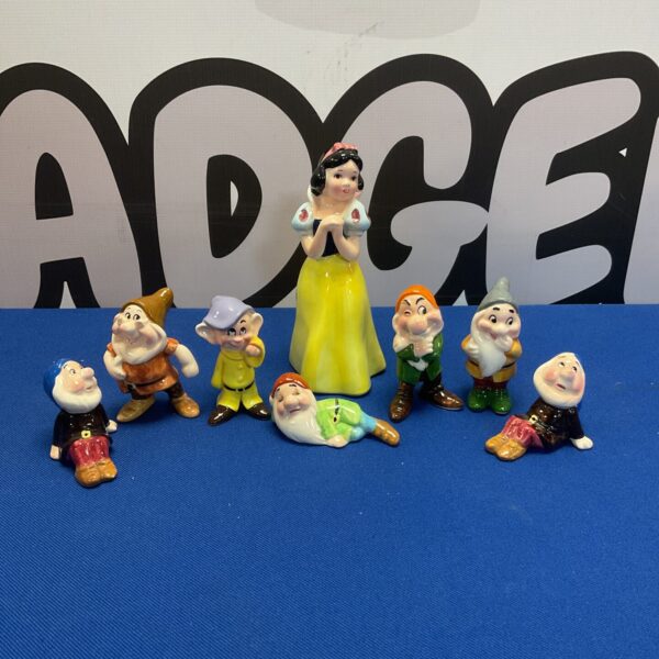 Vintage porcelain Snow White and Seven Dwarfs figurines set.