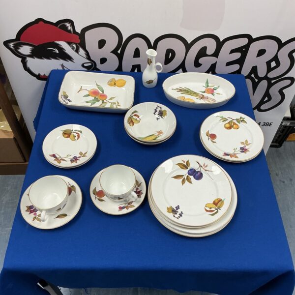 Vintage Royal Worcester tableware with floral patterns on display.