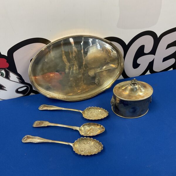 Vintage silver plate serving set with tray, caddy, and spoons.