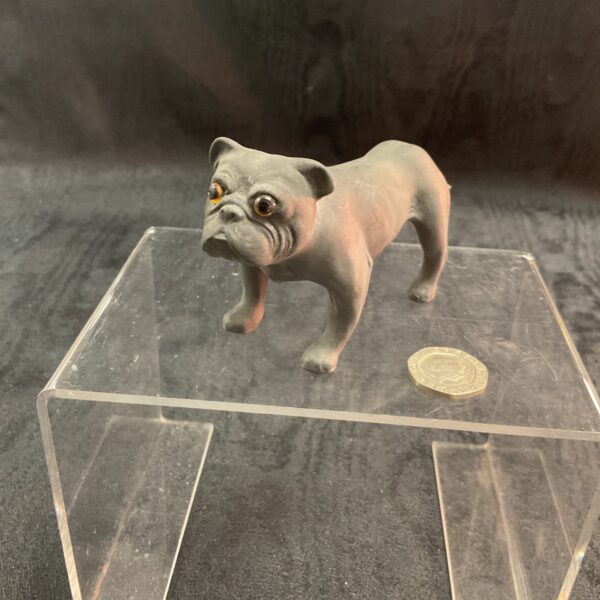 Antique black basalt bulldog figurine with glass eyes.