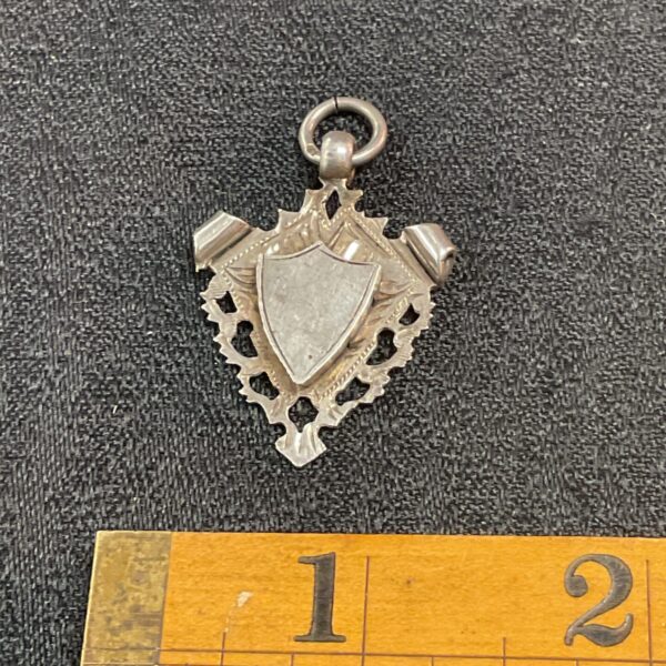 Antique silver fob medal with shield design, hallmarked Birmingham 1903.