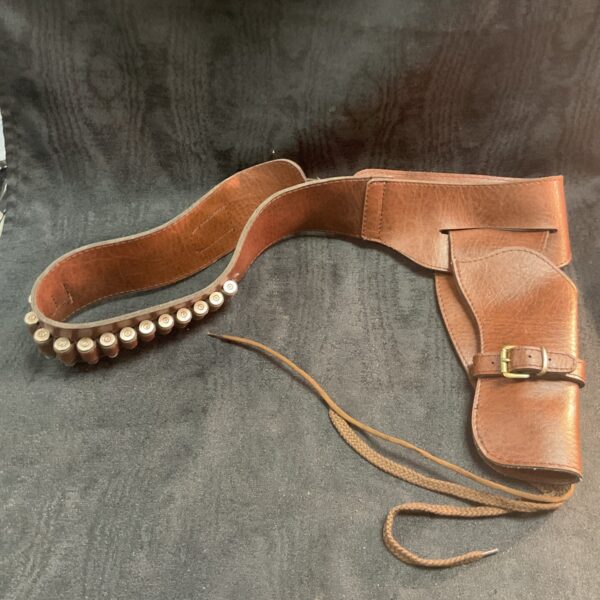 Vintage cowboy pistol belt with leather holster and cartridge loops.