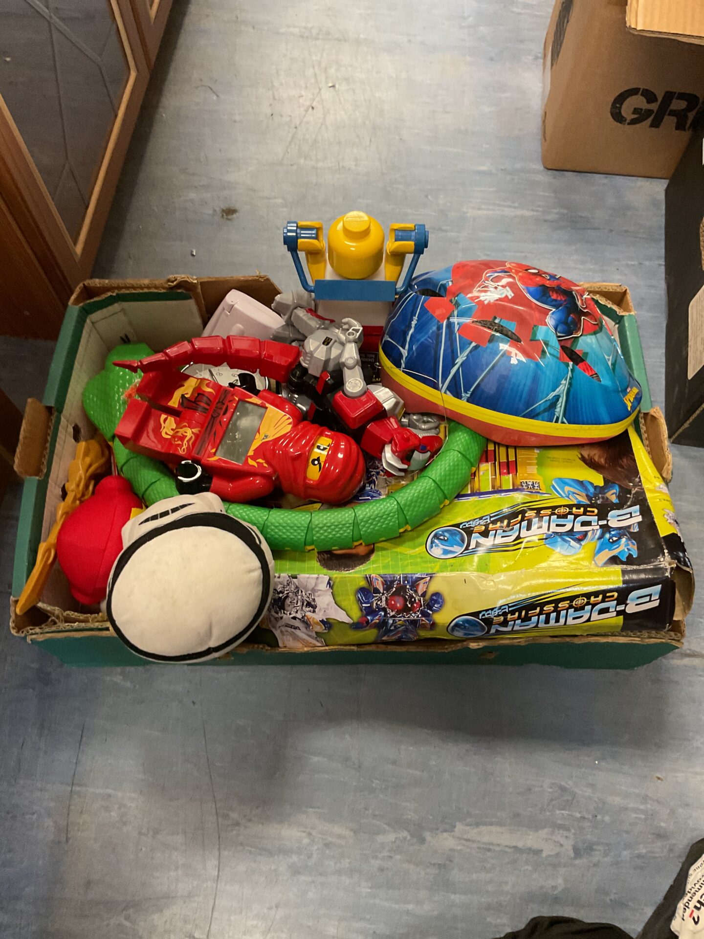 415 Box of mixed toys inc lego ninjago clock and electric snake with remote