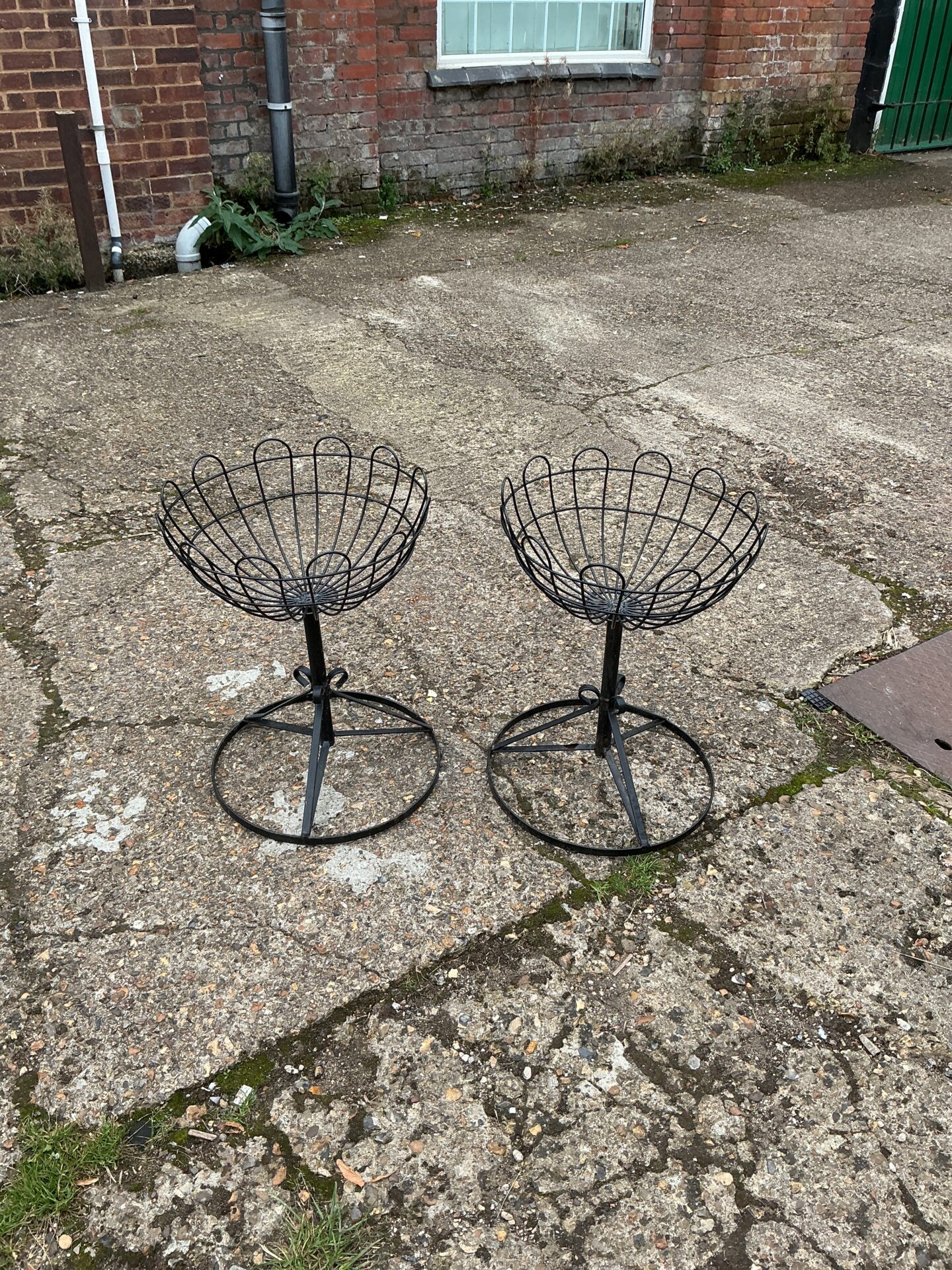 1239 Two metal garden basket stands