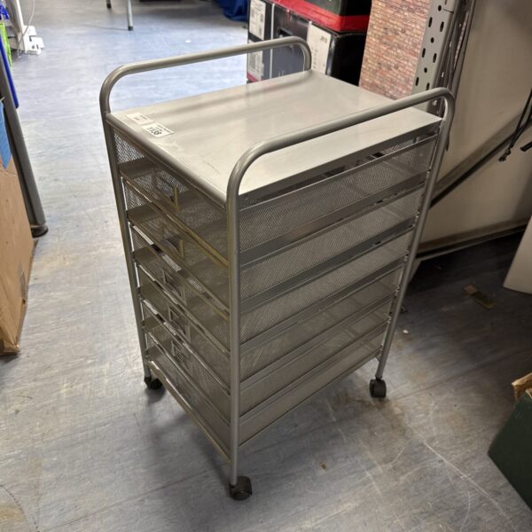 Metal filing cabinet on wheels with mesh drawers for office storage.
