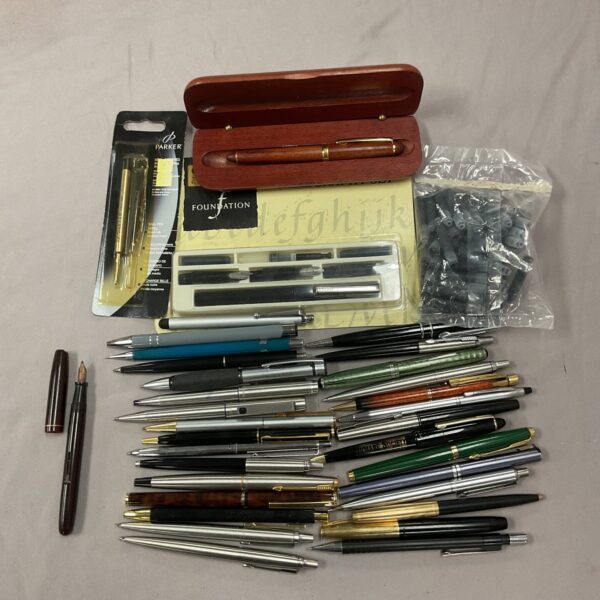 Overview of a vintage pen collection with various fountain pens.