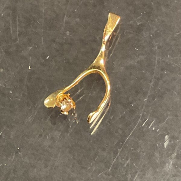 Delicate 9ct gold wishbone charm pendant for jewellery.