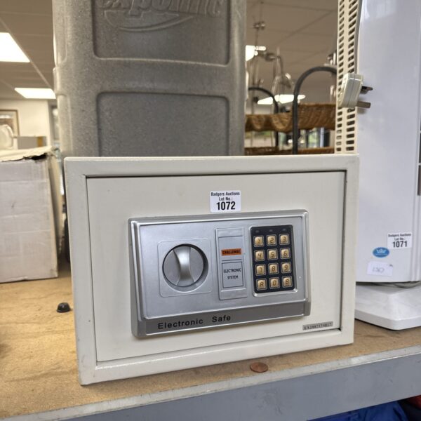 Front view of a grey Challenge digital safe with keypad.