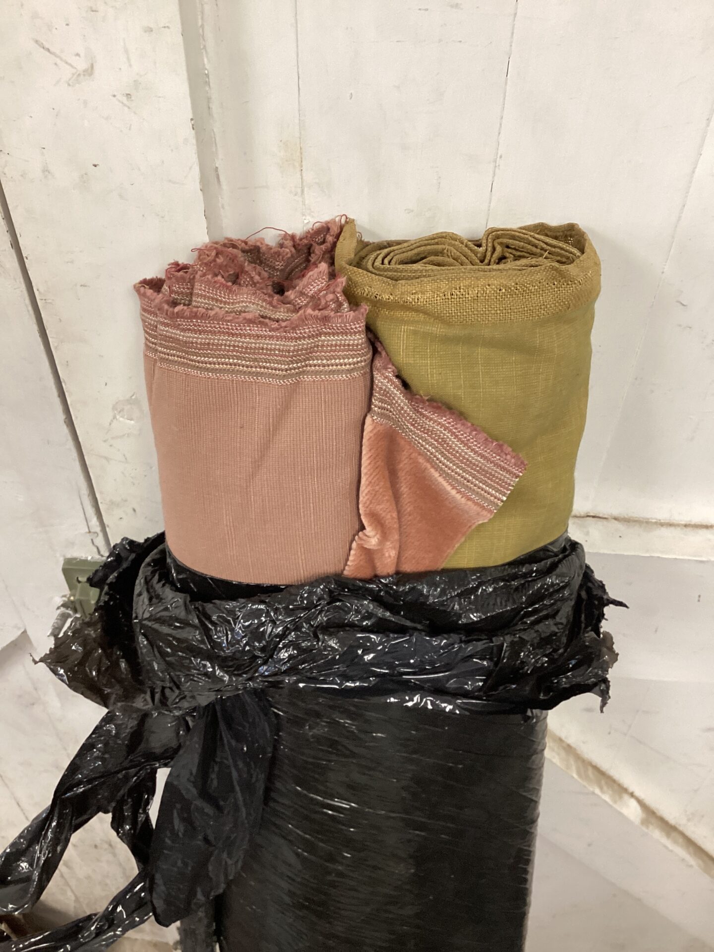 586 Two rolls of fabric one green & one pink
