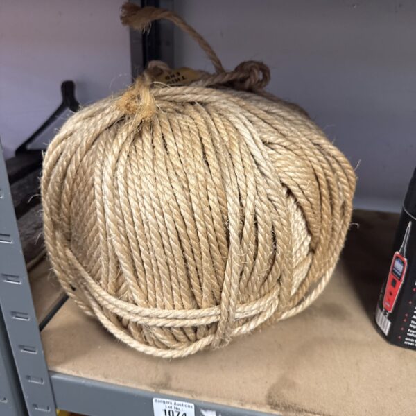 Large coil of heavy-duty sisal rope for various uses.
